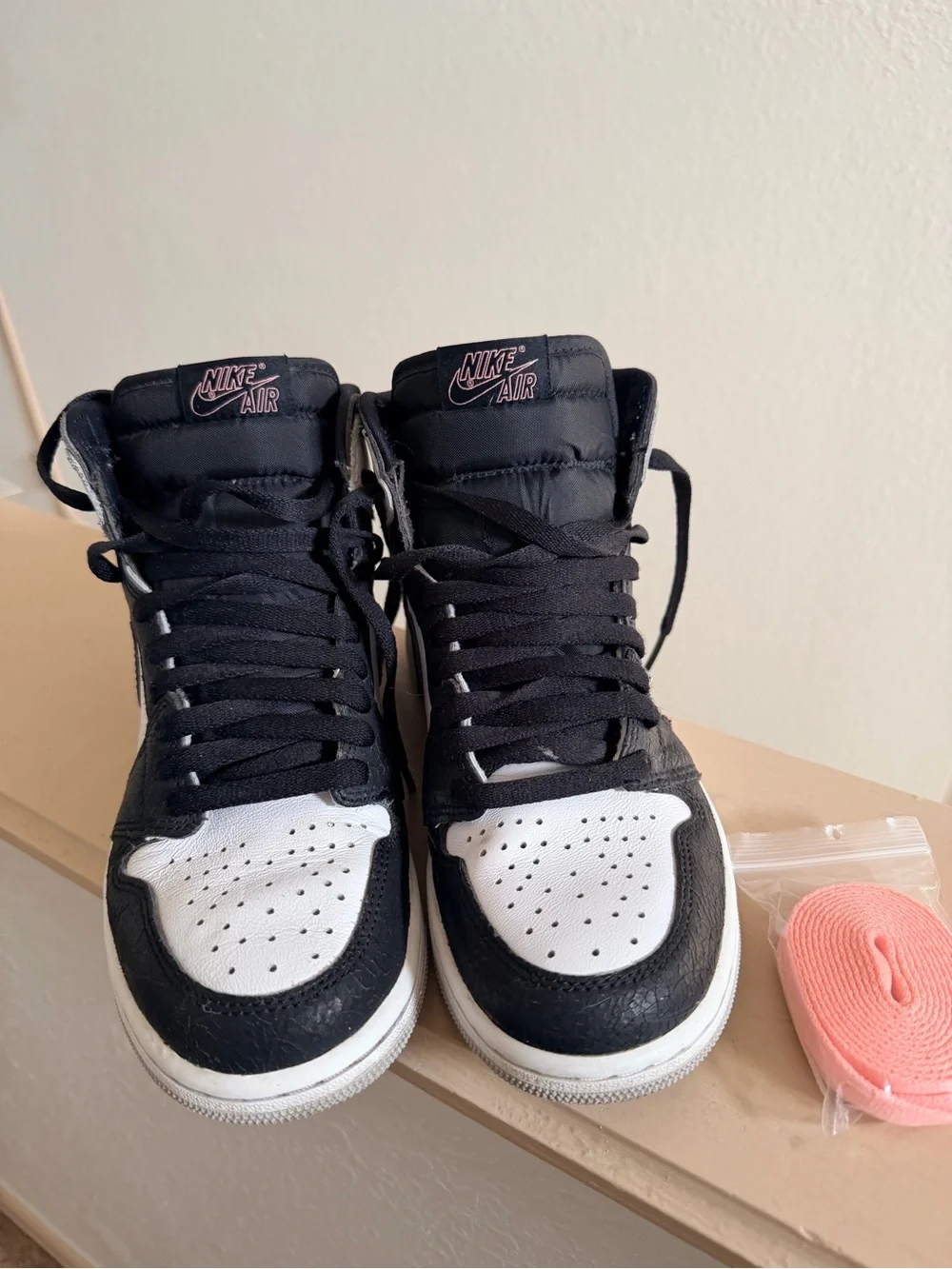 Nike Air Jordan 1 Black and White High-Top Sneakers with Pink Accent
